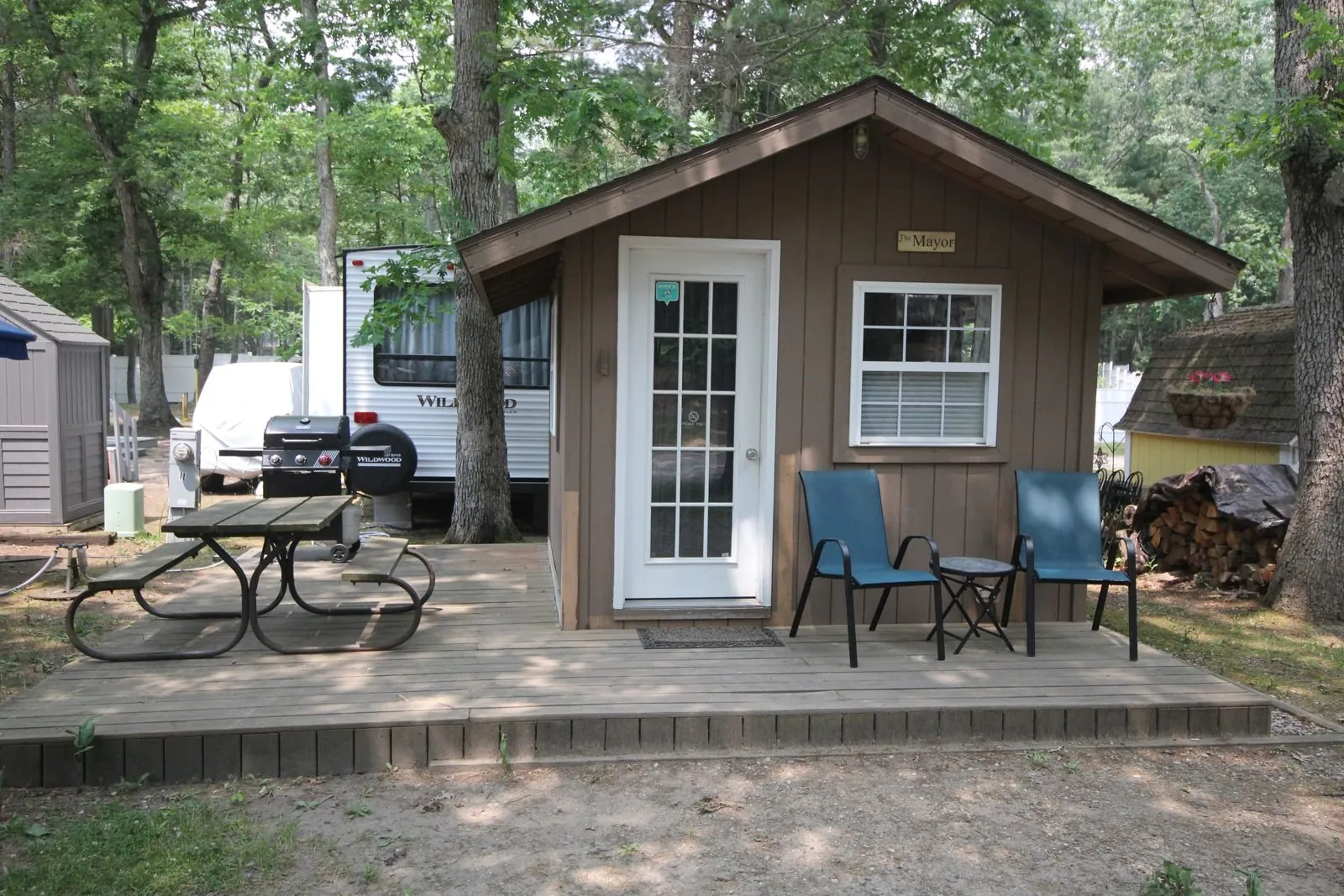Mayor Cabin with a picnic table and camp chairs out front