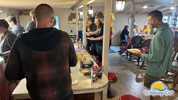 Campers lining up for breakfast in the decorated Lodge on Halloween weekend