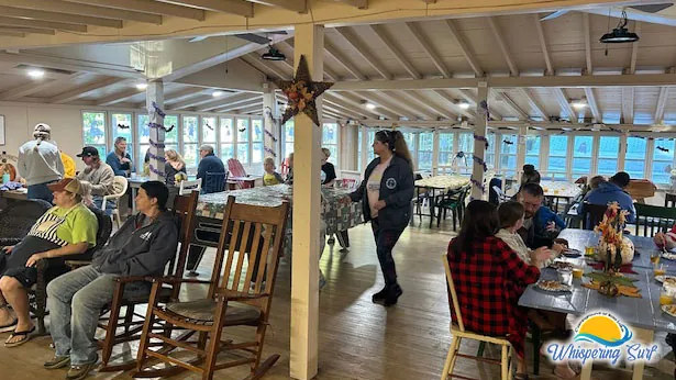 Campers sharing the Halloween pancake breakfast at Lodge tables