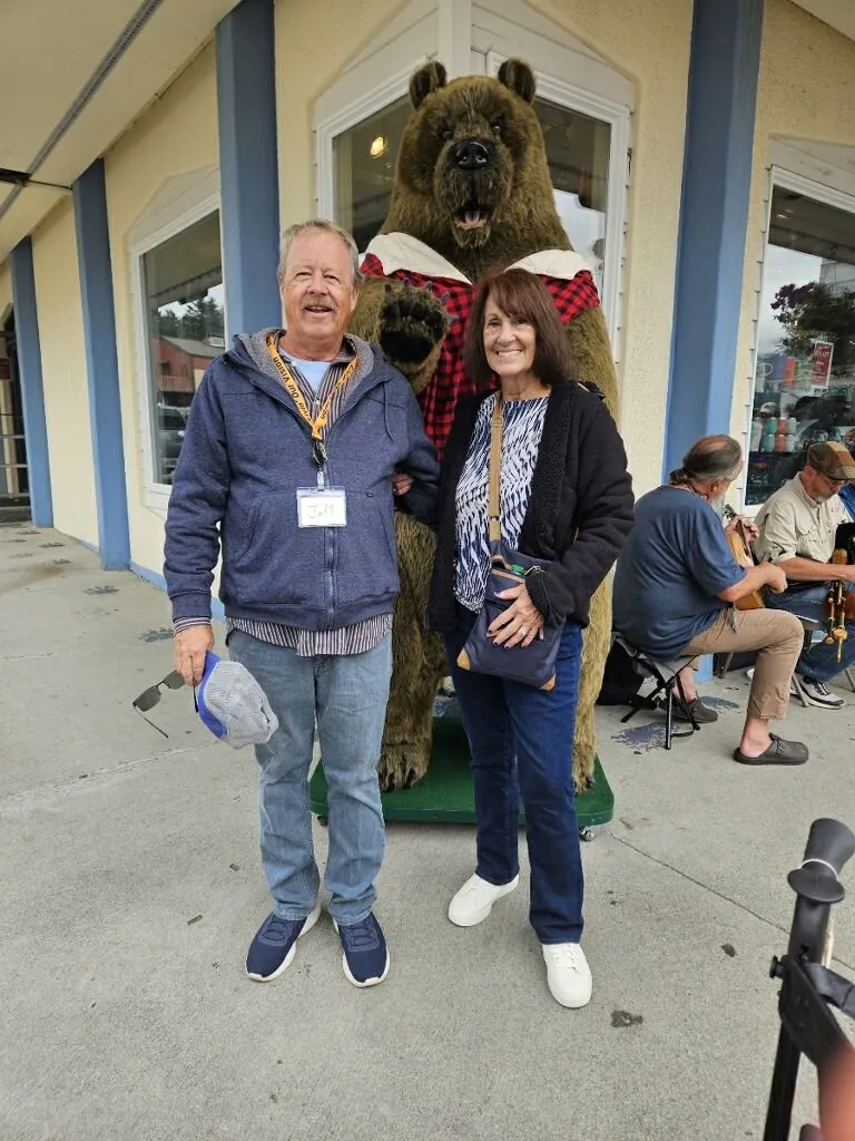 Jeff and Cherie, returning work campers, standing outside the camp store